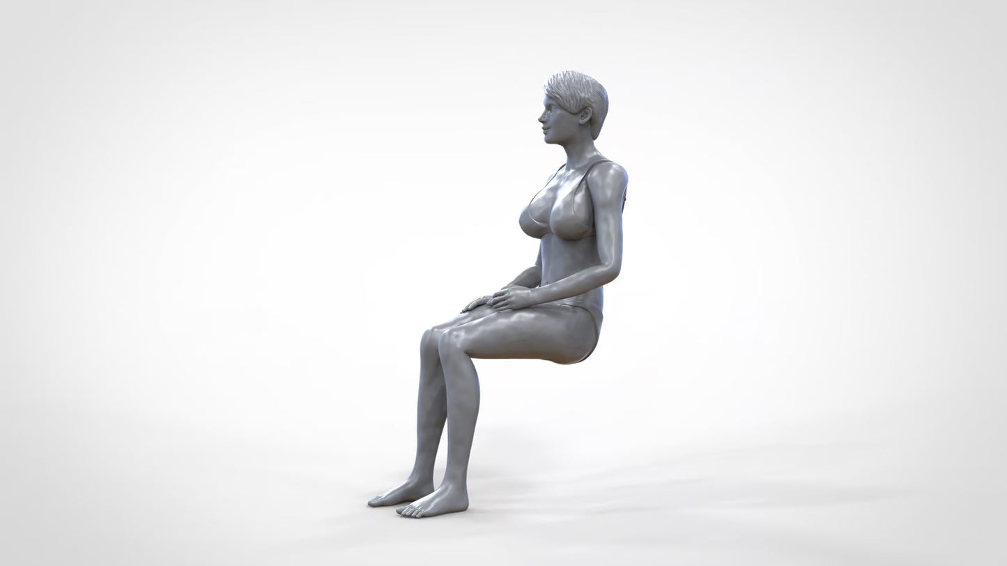 Product photo 0: Woman in bikini - sitting