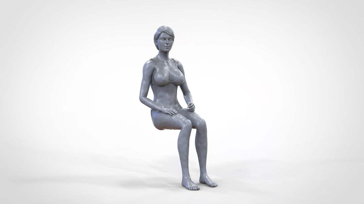 Product photo 0: Woman in bikini - sitting