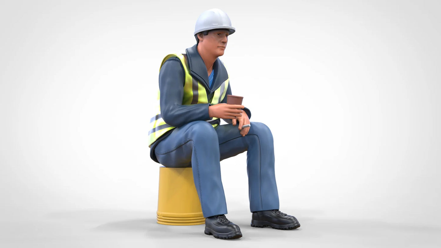 Product photo diorama and model building miniature figure: construction worker sitting on a bucket