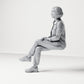 Diorama model-making product photo 1: Seated figure: female spectator with crossed legs and hands on her knee (B056)
