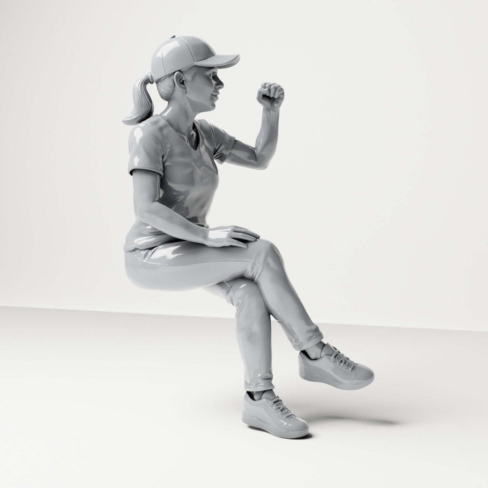 Diorama model-making product photo 3: Seated figure: female spectator with crossed legs & raised fist (B057)