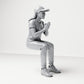 Diorama model-making product photo 3: Seated figure: female spectator with hands clasped in front of her chest (B058)