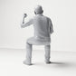 Diorama model-making product photo 2: Seated figure: Male spectator with raised clenched fist (B065)