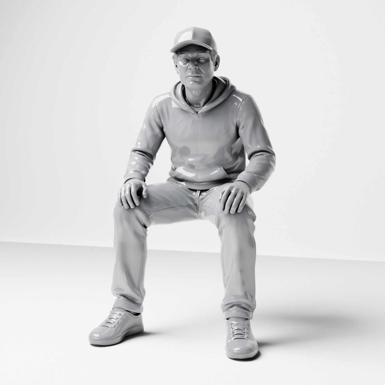 Diorama model-making product photo 0: Seated figure: man with cap & hoodie (B070)