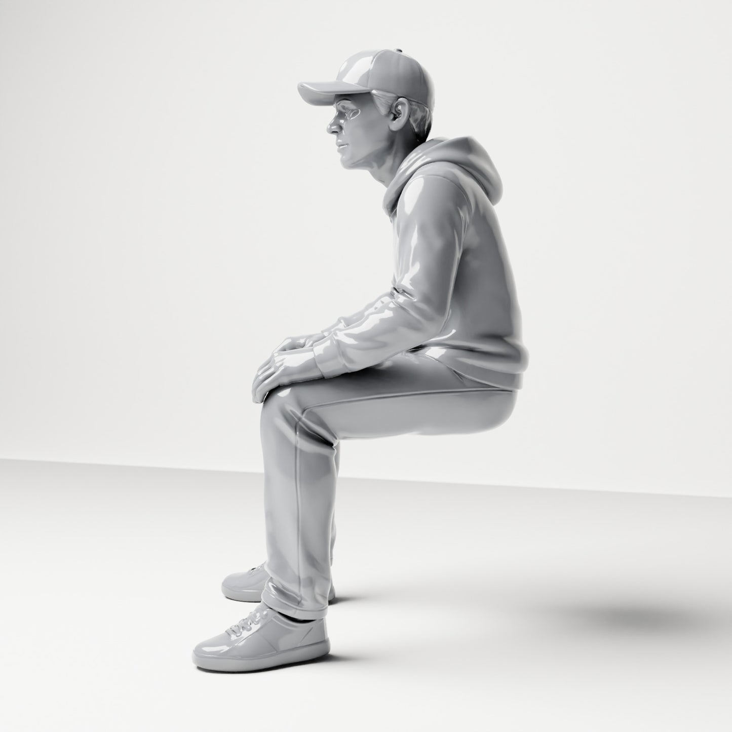 Diorama model-making product photo 1: Seated figure: man with cap & hoodie (B070)