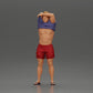 Diorama model building product photo 0: Standing miniature: muscular man in shorts pulling T-shirt over his head (Ref No. A90)