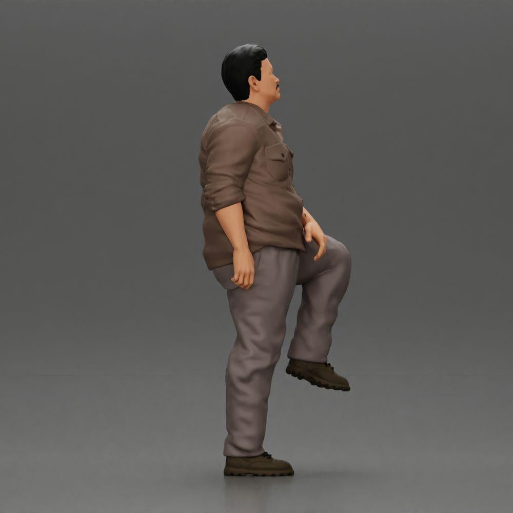 Diorama model building product photo 1: miniature figure: stout Asian man, looking up, in shirt, foot on step (Ref No. A101)
