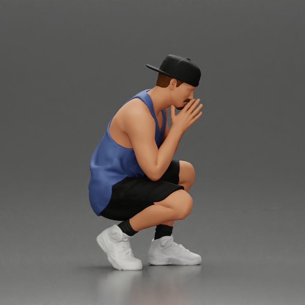 Diorama model building product photo 2: Diorama miniature: Thoughtful man sitting with cap, shorts, and sneakers (Ref No. A77)