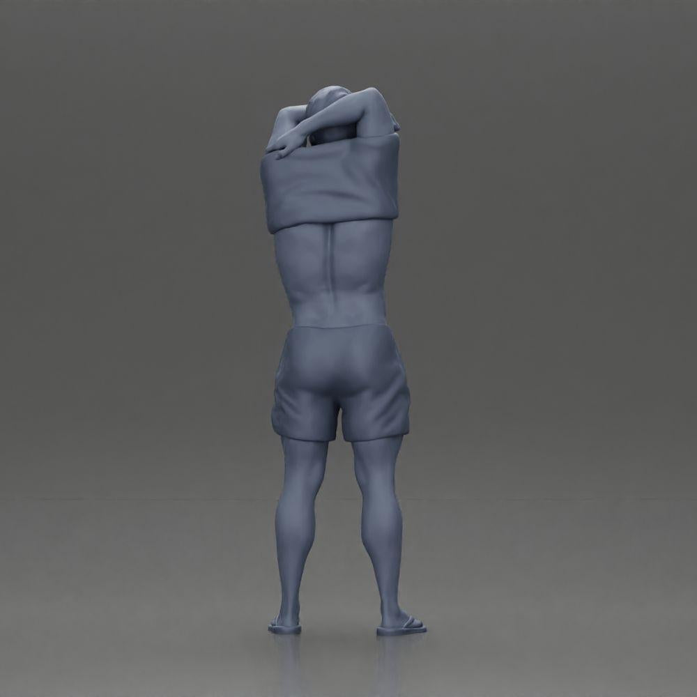 Diorama model building product photo 9: Standing miniature: muscular man in shorts pulling T-shirt over his head (Ref No. A90)