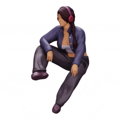 Diorama model building product photo 0: Young girl sitting and listening to music with headphones (Ref No. A42)