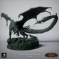 Product photo Tabletop 28mm Lord of the Print (LotP) 6: Tabletop Fantasy miniature set: Black Dragon Hunt - Black Dragon with hunting dogs on scenic rock base (26_03_A1)