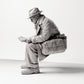 Diorama model building product photo 1: Sitting figure: Man sitting on bench edge, 1920s traveler with newspaper and shoulder bag (sc07)