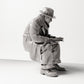 Diorama model building product photo 4: Sitting figure: man sitting on bench edge, 1920s traveler with newspaper and shoulder bag (sc07)