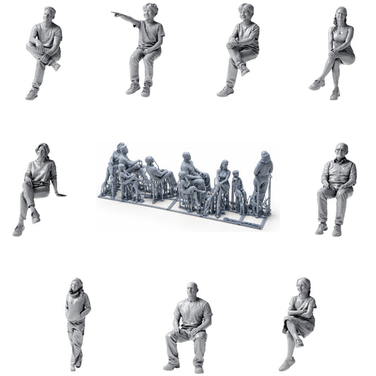 Seated figures and bystanders - 9 unpainted resin miniatures in an open overview