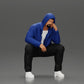 Diorama model-making product photo 0: Kneeling figure: Crouching man in a hooded jacket with hand on face (a163)