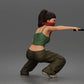 Diorama model-making product photo 2: Diorama figure: Crouching masked woman with pistol, crop top & baggy trousers (a169)
